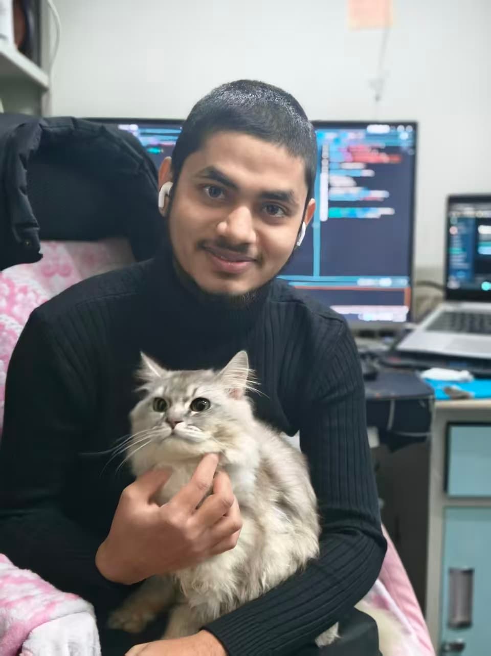 A M Sayed - Coding workspace with multiple monitors